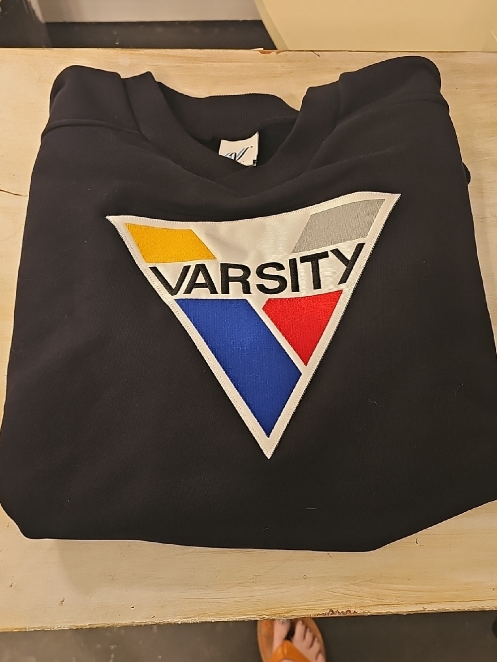 Varsity Black Sweatshirt with Multicolor Triangle Logo (Yellow, Gray, Blue, Red)